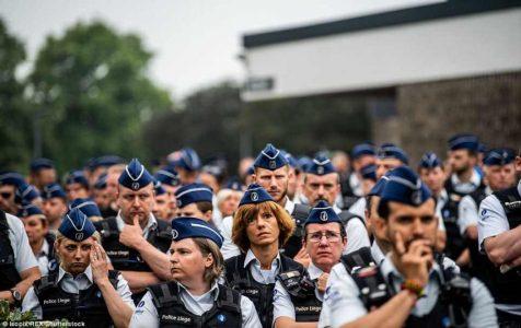 Hundreds of officers line on the streets of Liege to honour two policewomen slained by ISIS terrorist