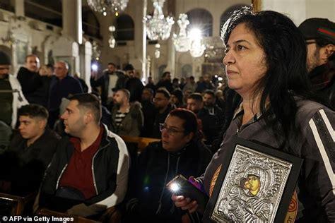 Fears for Christians in Syria as Christmas tree is burned down in first major sign the religious minority will be targeted after the fall of Assad – prompting protests in Damascus